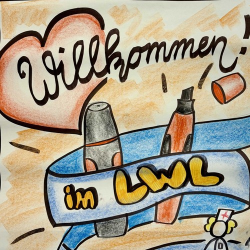 Ein buntes Plakat auf dem "Willkommen beim LWL" steht.